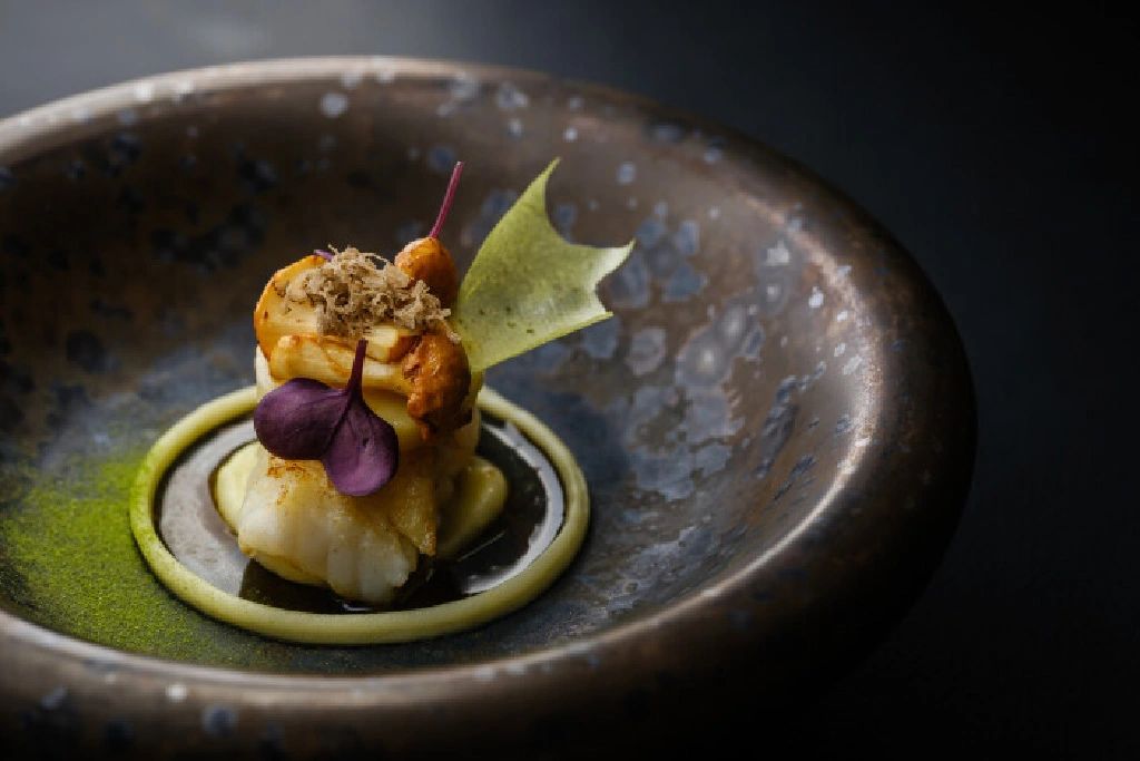 Elegant gourmet dish on dark plate