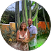 Couple posing with cacti background.