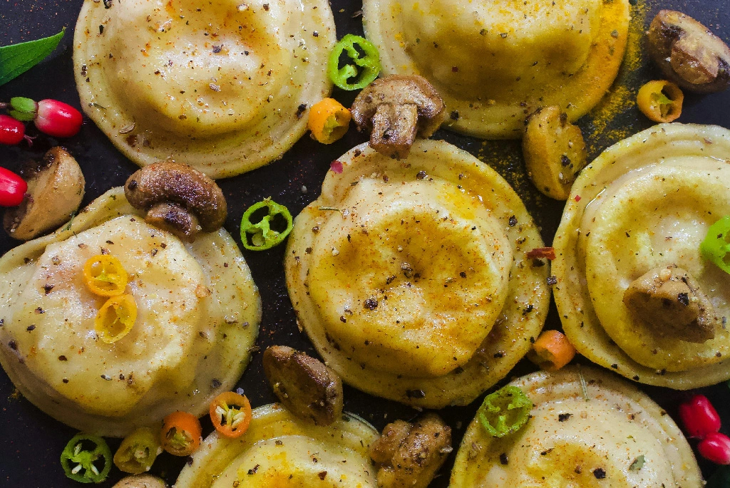 Delicious ravioli with spices and toppings
