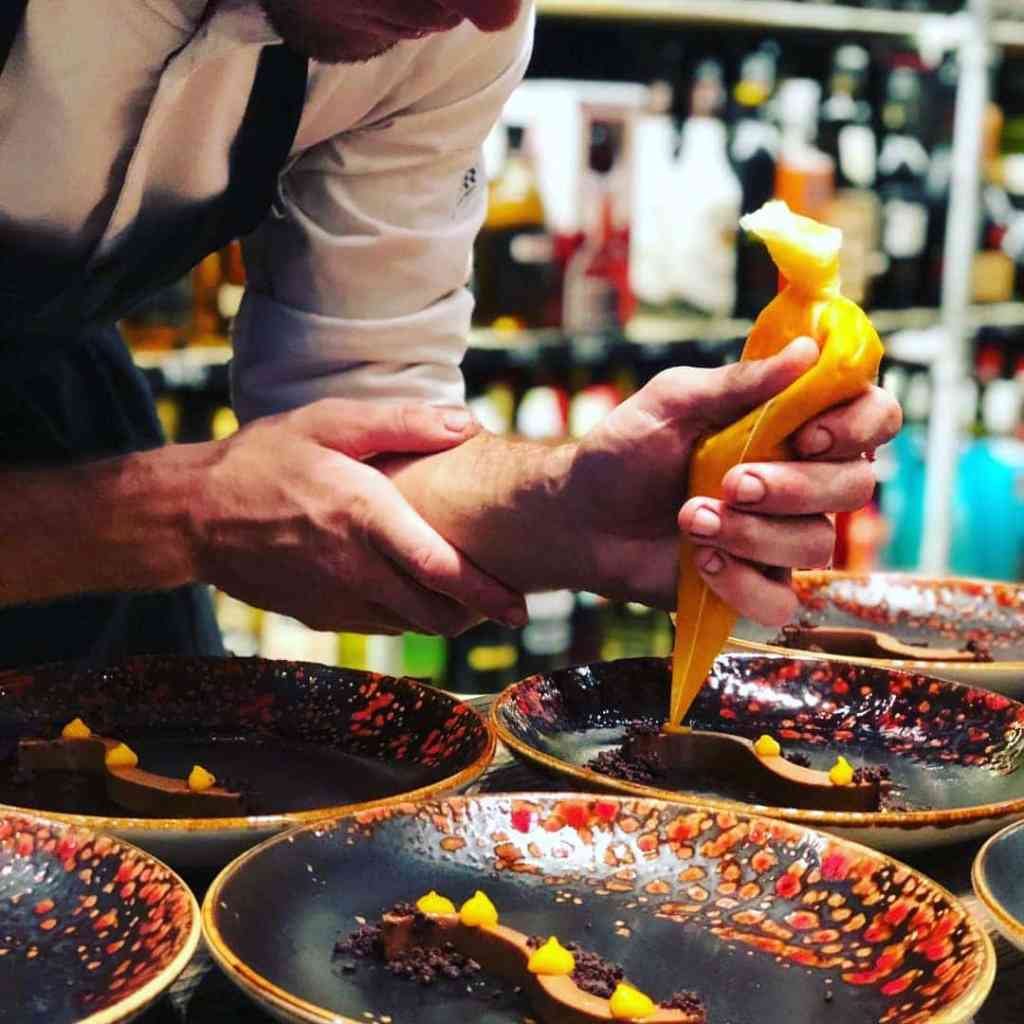 Chef plating dessert with precision.