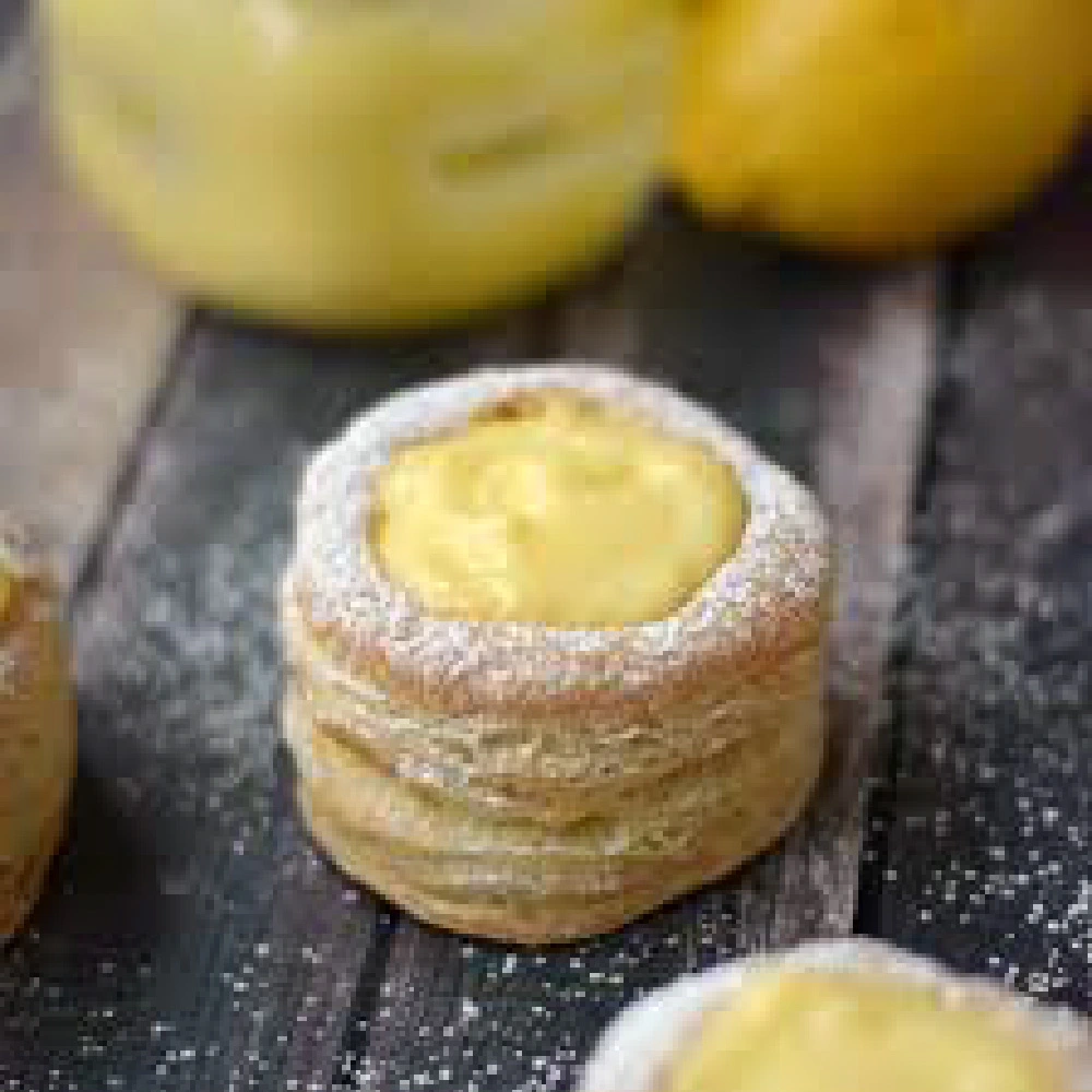 Lemon tart on wooden surface.